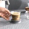 راهنمای سایز ماگ پیرکس طرح نوشته قهوه و قلب در دست.