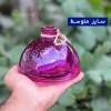 سایز متوسط از گلدان رنگی مدل ریما در دست نگاه داشته شده است.