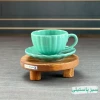 فنجان سرامیکی مدل صدفی رنگ سبز پاستیلی.