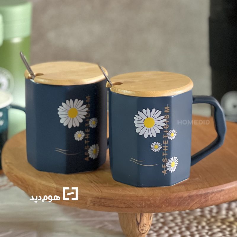 ceramic mug with chamomile design and text with lid